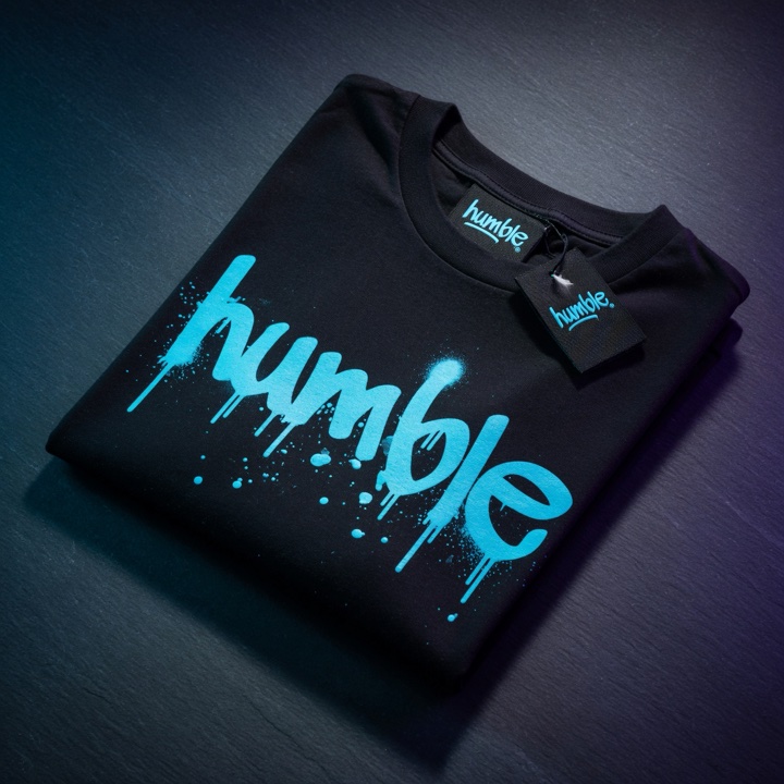 Humble Beginning Tee — black with cyan humble drip graphic